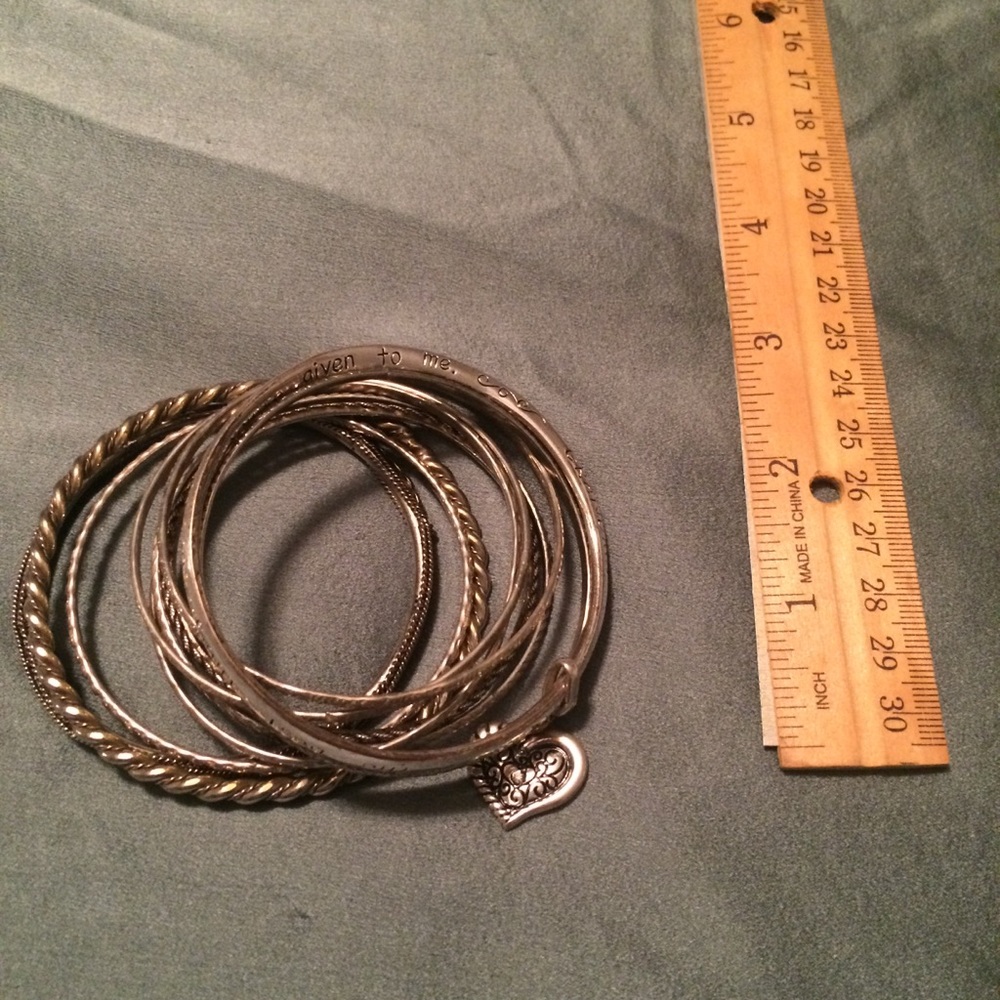 Bunch of silver bangle bracelets